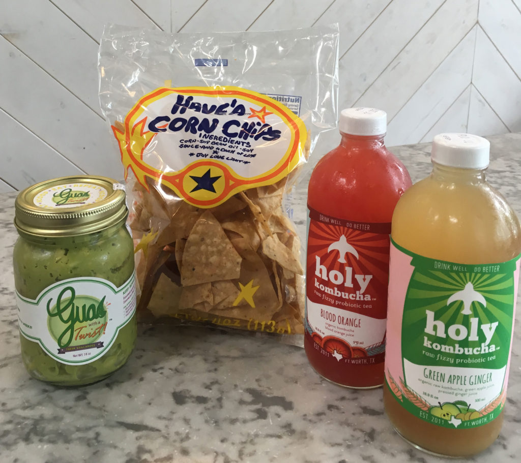 Guac with a Twist, Have'A Corn Chips, Holy Kombucha fizzy probiotic tea in Blood Orange and Green Apple Ginger. All locally made and available at Royal Blue Grocery.